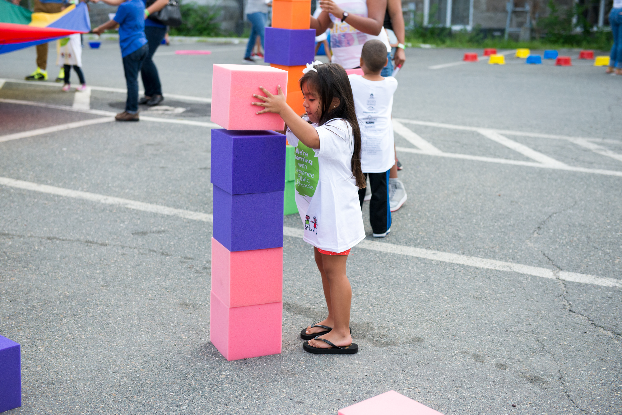Child stacking big blocks on top of each other